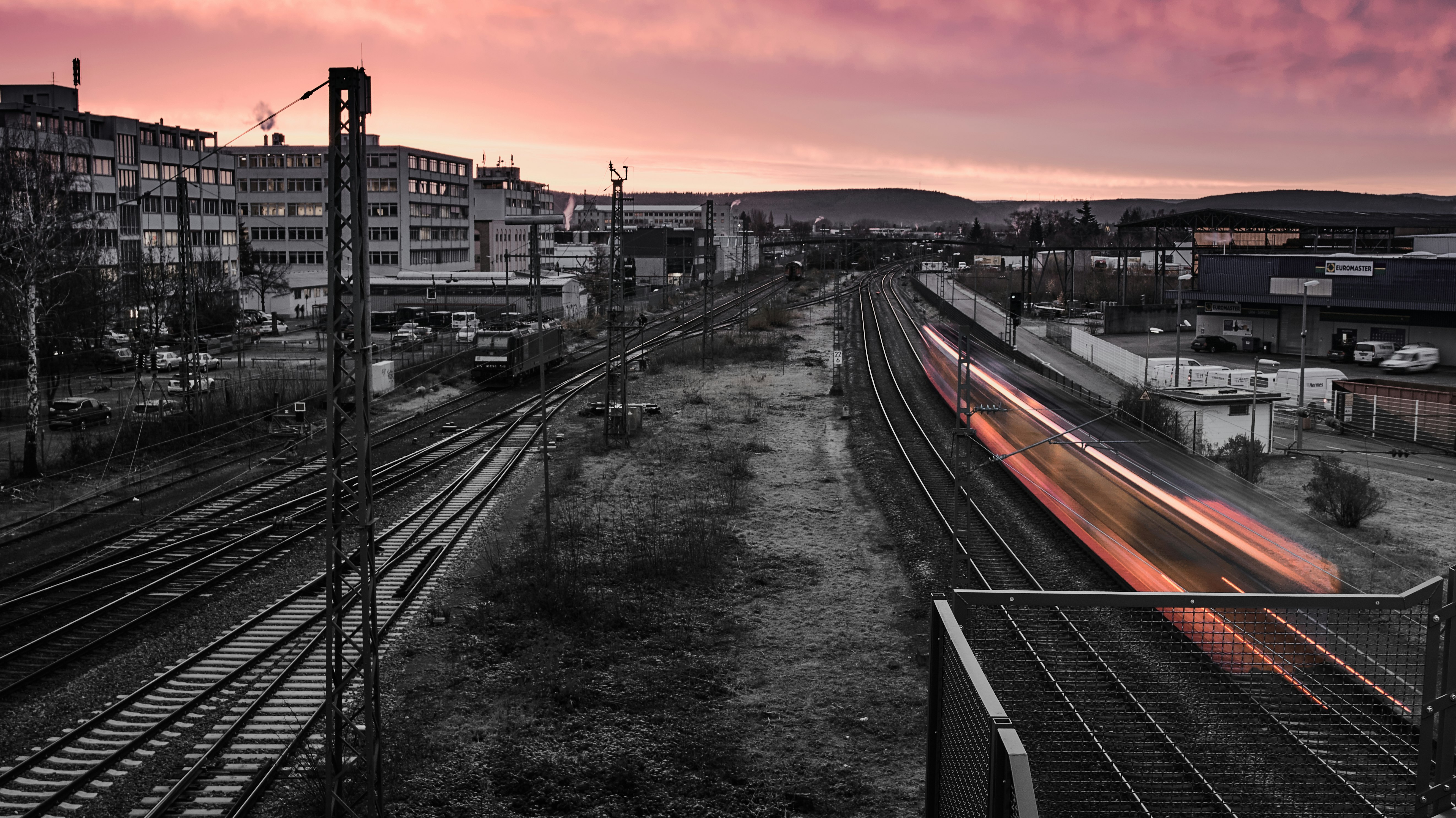 time lapse photo of train passing by